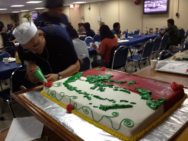 The culinary staff prepares for PP12 Indonesia opening day festivities with an incredible cake.