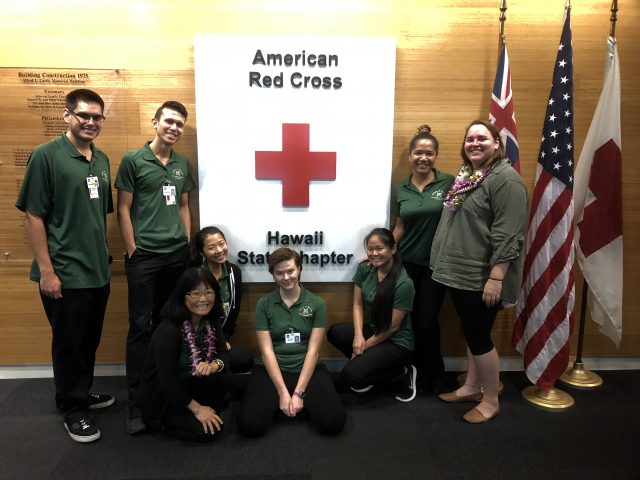 students work with red cross