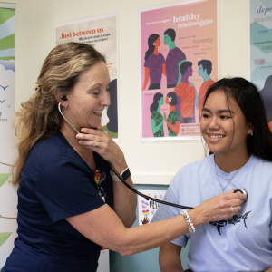 Nurse On The Big Island Listening To A Student's Heart