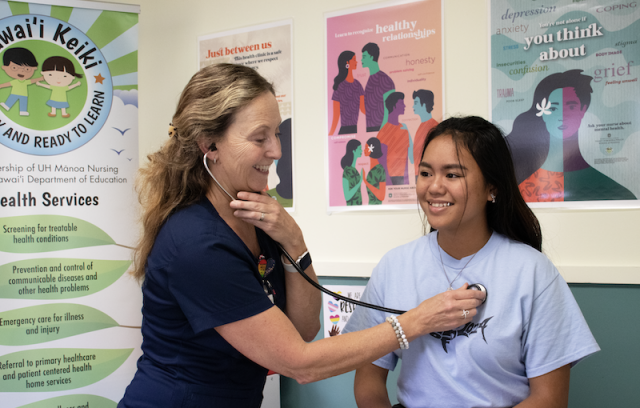 Nurse on the Big Island listening to a student's heart