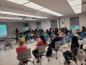 Students gather in a classroom to hear about the HONU Scientists program 