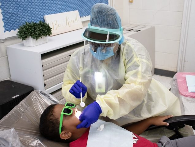 Dental Hygienist conducts dental assessment and sealant at school