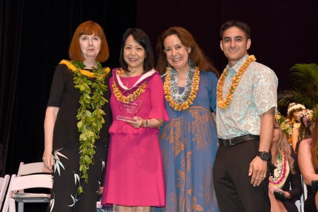 lori kaneshige poses for group photo 