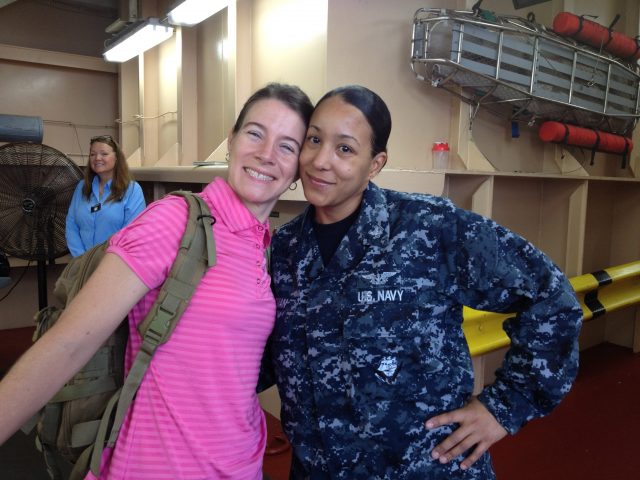 Professor Carrie Davis & teammate HM2 Amirah Roman smile for photo 