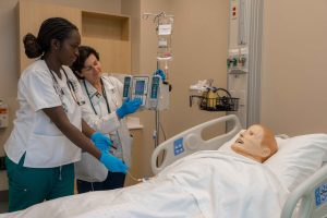 graduate entry program in nursing student and faculty in simulation lab
