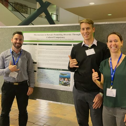 Representatives of the American Assembly for Men in Nursing at University of Hawaii present poster