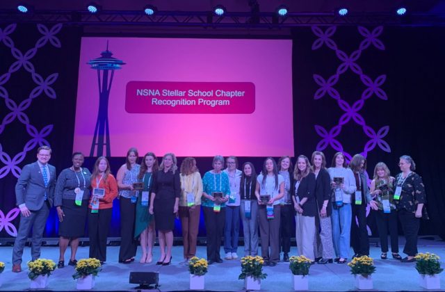 SNA Manoa students on stage accepting award