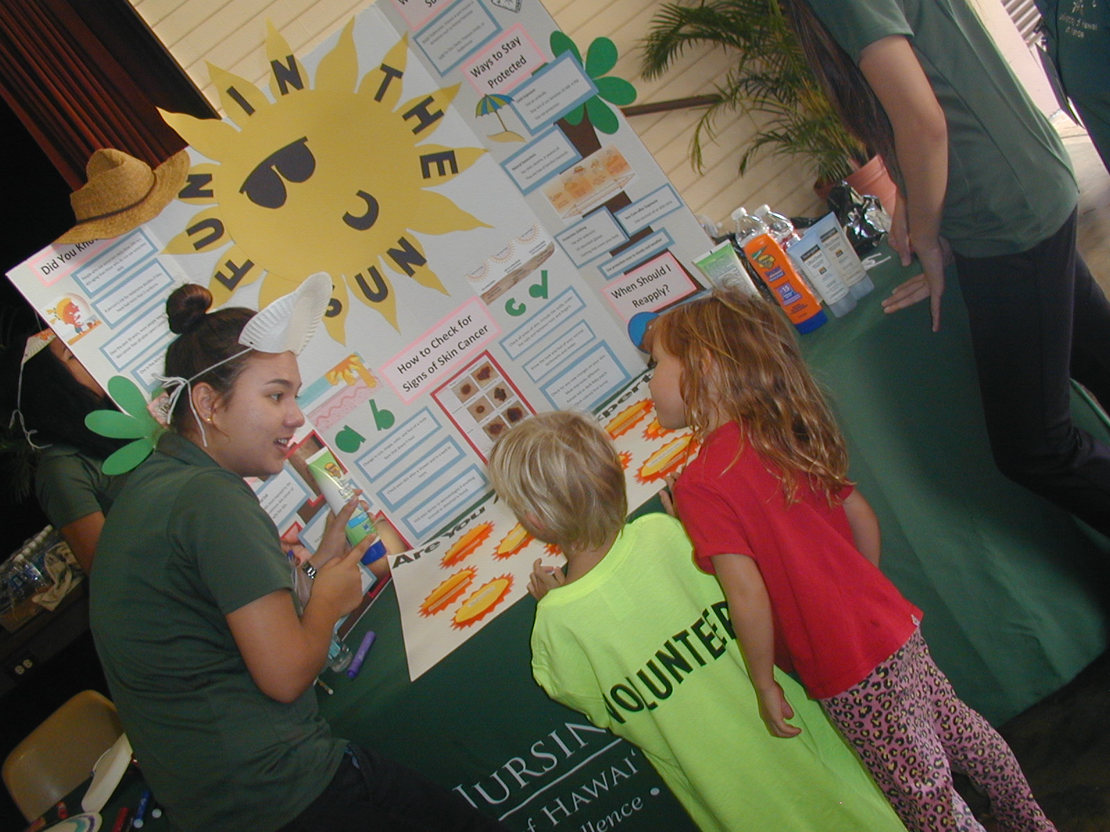 students interact with keiki on YMCA Healthy Kids Day