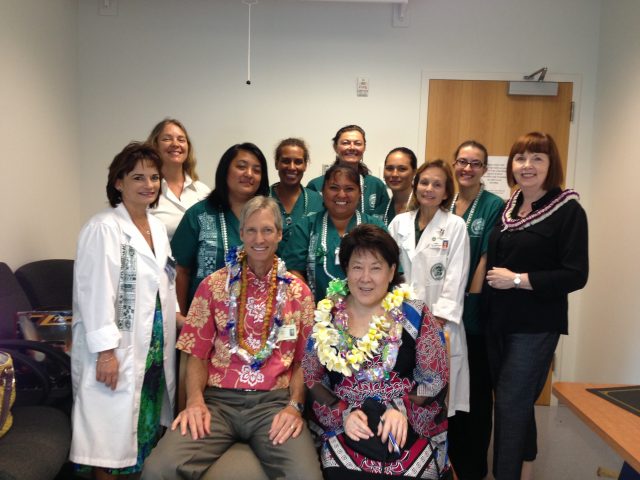 First Special Class of Graduates smile for group photo with Mary G. Boland 