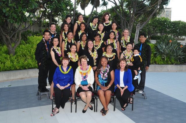 First Special Class of Graduates smile for group photo with Mary G. Boland