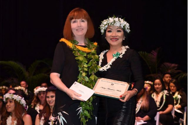 Nancy Atmospera-Walch receiving the Dean's Award in 2017