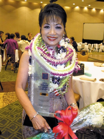 Nancy Atmospera-Walch smiles for photo after receiving award