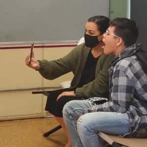 student and parent doing telehealth on a cell phone